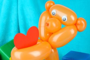 Bear balloon sculpting in orange